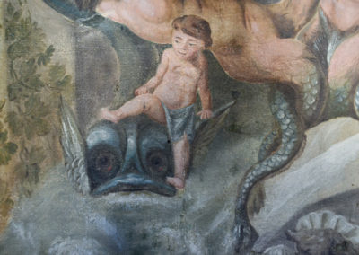 Close crop of one of the 18th century tapestries in the house, featuring a young boy riding a dolphin