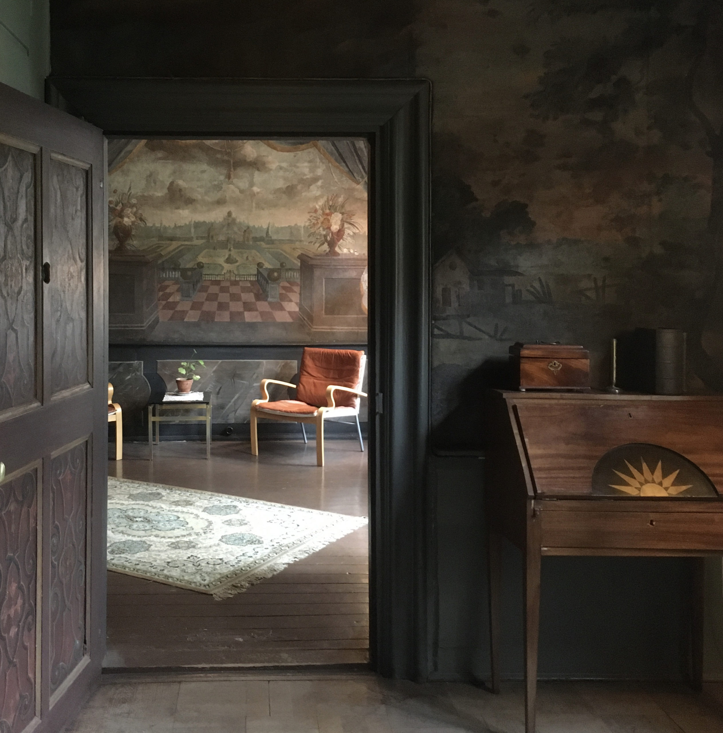 IMG_9332 crop A room featuring two chairs, a cabinet, a rug and a plant