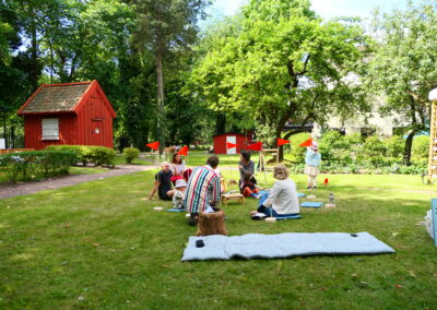 A group of people sitting in a garden